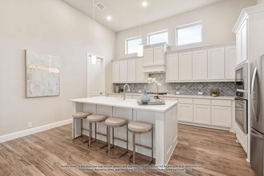 Kitchen with white cabinets, center island with seating, herringbone tile backsplash, and hardwood floors under high ceilings. Kitchen with white cabinets, center island with seating, herringbone tile backsplash, and hardwood floors under high ceilings.