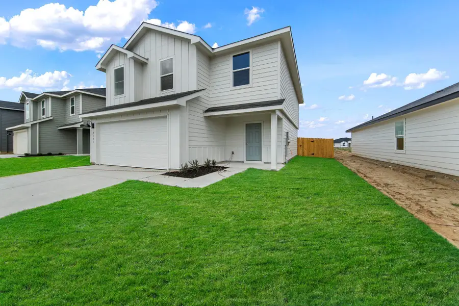 Front exterior of a new home in Ladera, Luling, TX, highlighting curb appeal (Image 1). Front exterior of a new home in Ladera, Luling, TX, highlighting curb appeal (Image 1).