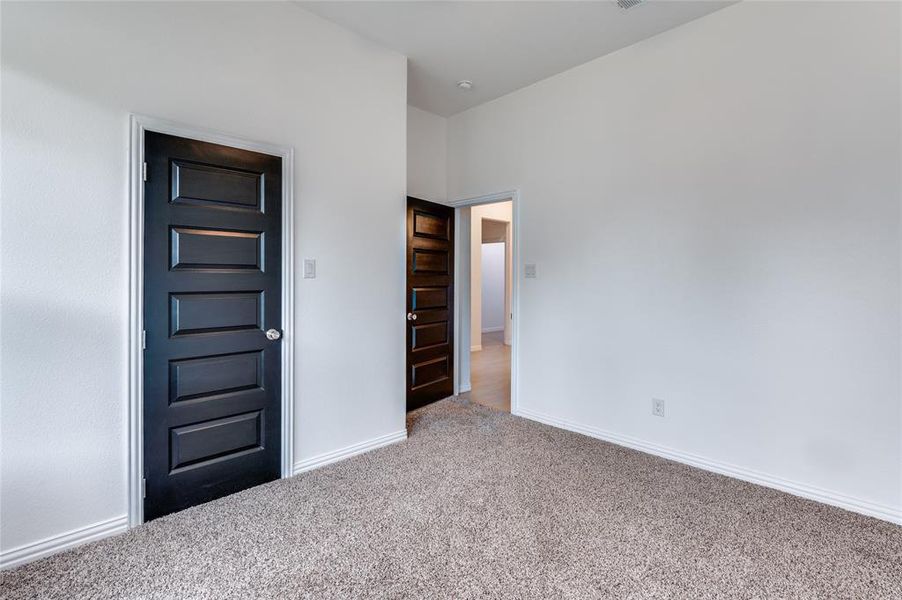 Unfurnished bedroom featuring carpet