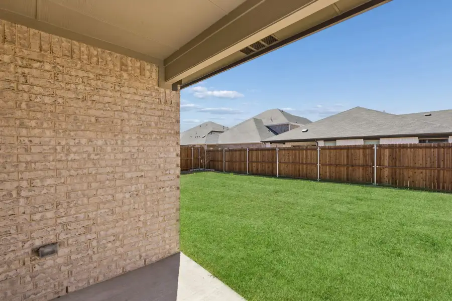Covered Patio in the Harrison home plan by Trophy Signature Homes – REPRESENTATIVE PHOTO Covered Patio in the Harrison home plan by Trophy Signature Homes – REPRESENTATIVE PHOTO