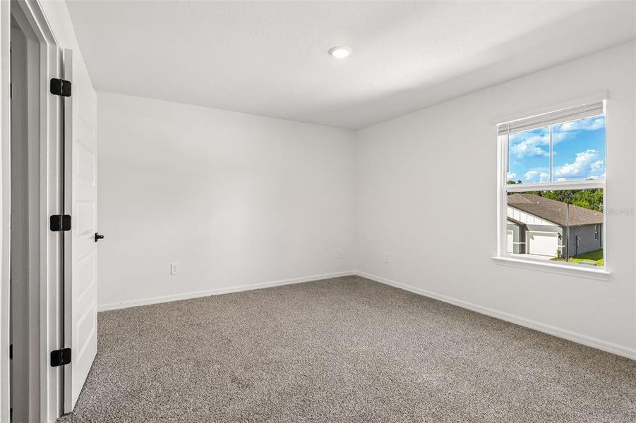 Spacious, unfurnished interior of a new home in The Grove at Stuart Crossing - Signature Series, Bartow (Image 38).