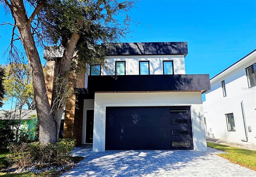 Front exterior of a new home in , Sarasota, FL, highlighting curb appeal (Image 32).