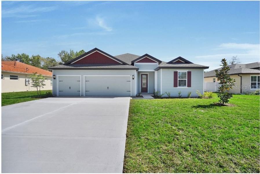 Front exterior of a new home in Marion Oaks, Ocala, FL, highlighting curb appeal (Image 2).