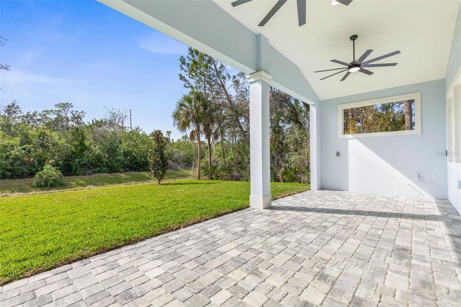 Exterior details and patio area of a home in Palm Coast Plantation, Palm Coast (Image 32).