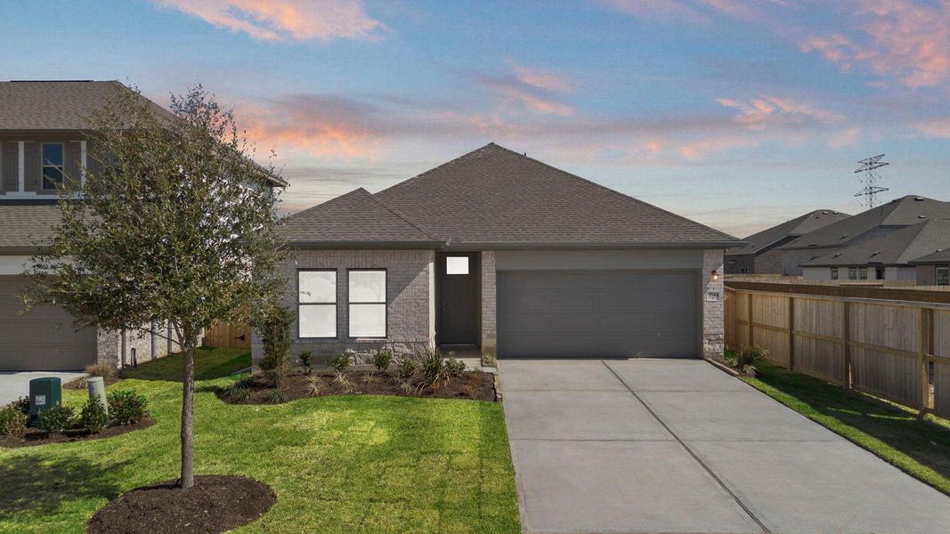 Front exterior of a new home in Windrose Green, Angleton, TX, highlighting curb appeal (Image 21).