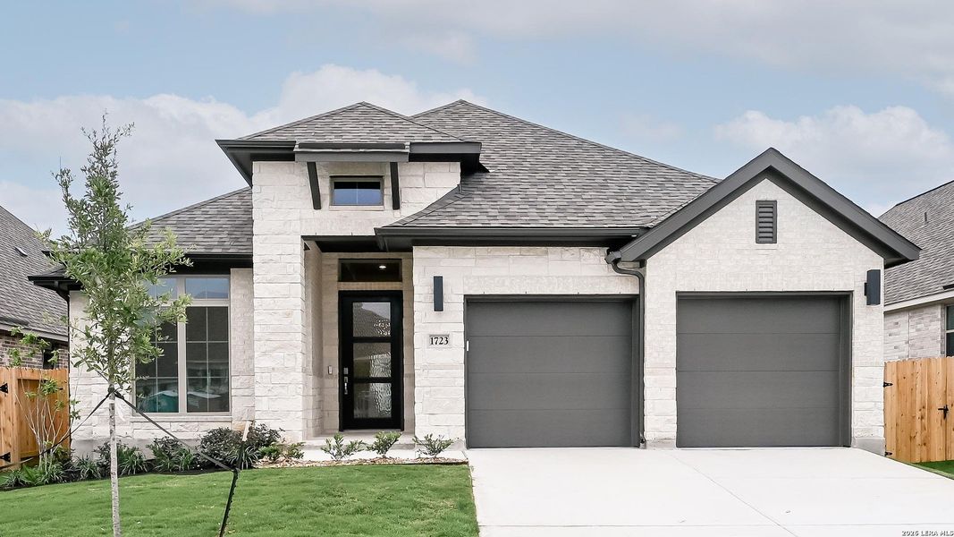 Front exterior of a new home in Meadows of Mill Creek, Seguin, TX, highlighting curb appeal (Image 17).