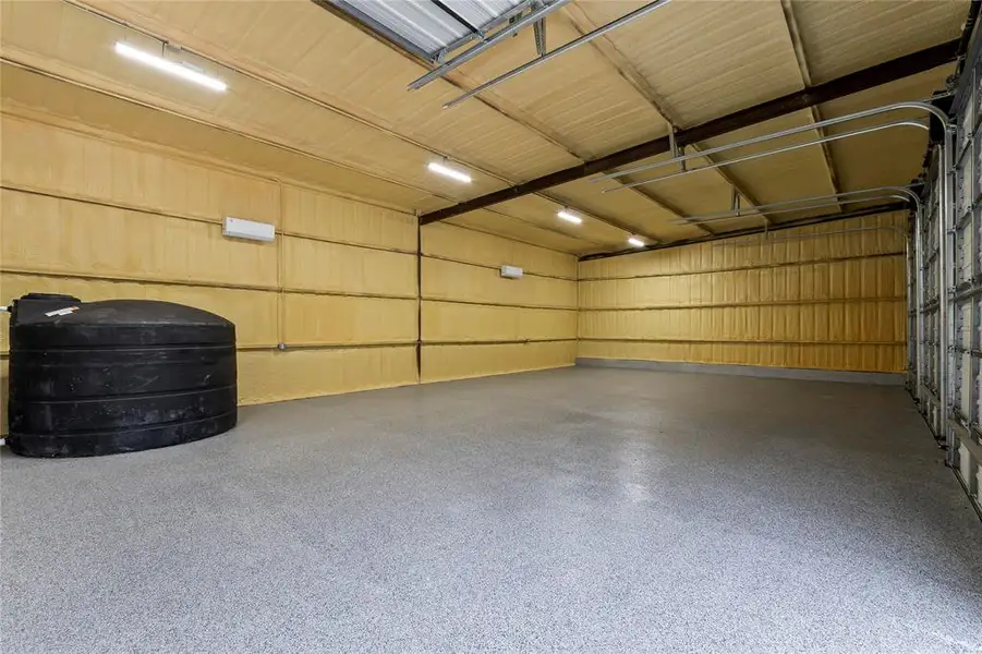 Interior of the 4 Bay Shop. Insulated w/ Spray Form and Climate Controlled. Perfect for the car collector or turn it into a huge game room! Pictures is the 1550 gal fresh water storage tank. Interior of the 4 Bay Shop. Insulated w/ Spray Form and Climate Controlled. Perfect for the car collector or turn it into a huge game room! Pictures is the 1550 gal fresh water storage tank.