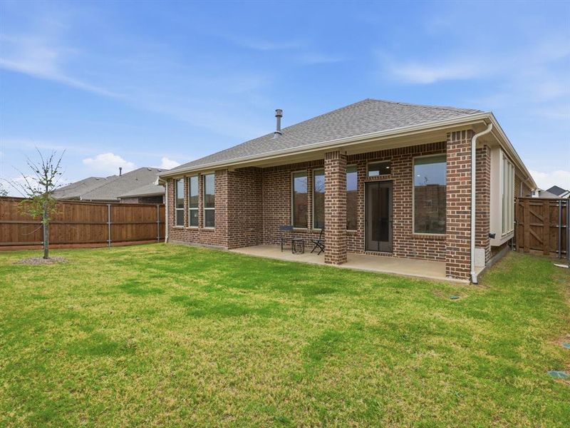 Exterior details and patio area of a home in , Little Elm (Image 16). Exterior details and patio area of a home in , Little Elm (Image 16).