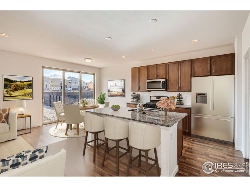 Home Under Construction. Photos are of the same Alpine floorplan, different home. Kitchen and Dining Home Under Construction. Photos are of the same Alpine floorplan, different home. Kitchen and Dining