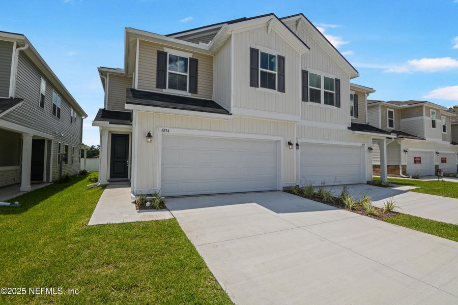 Front exterior of a new home in , Jacksonville, FL, highlighting curb appeal (Image 2).