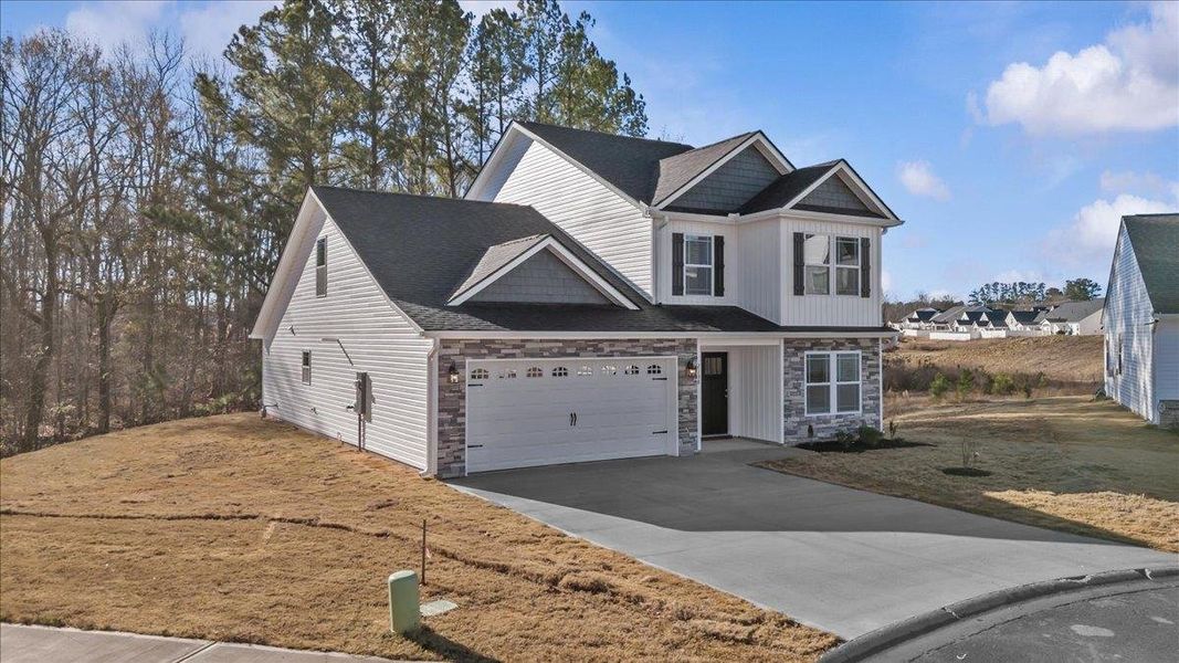 Front exterior of a new home in Zanes Creek, Inman, SC, highlighting curb appeal (Image 19).