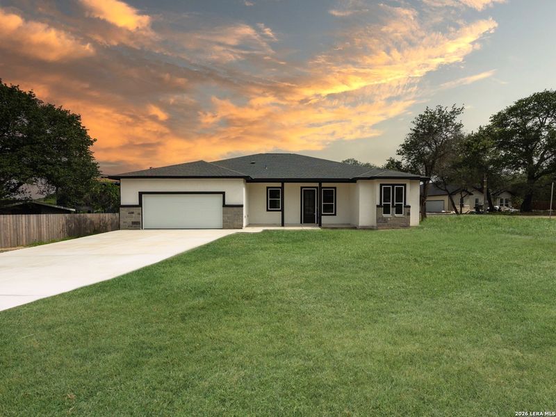 Front exterior of a new home in , Elmendorf, TX, highlighting curb appeal (Image 26). Front exterior of a new home in , Elmendorf, TX, highlighting curb appeal (Image 26).