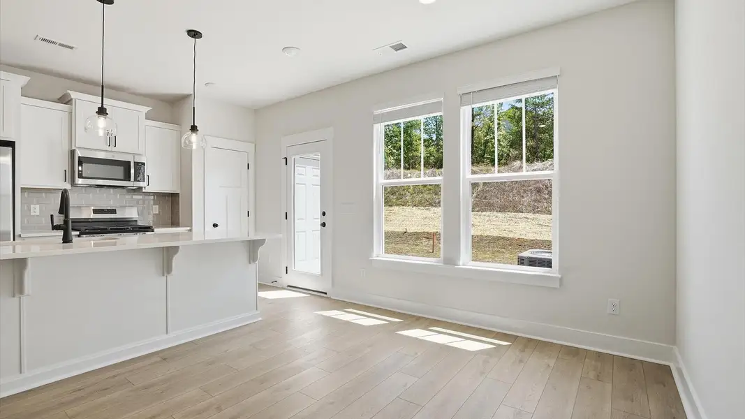This casual dining area features a seamless layout that makes mornings feel easy and welcoming in Greenville, SC