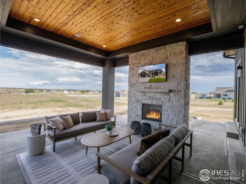 Outdoor fireplace/feature wall with real stone and T&G stained ceiling inlay