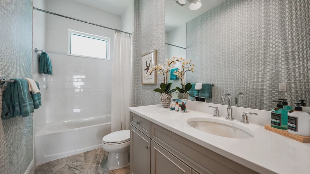 Representative furnished interior of a home built from the Bright Meadow 2 by Neal Communities in SkySail, Naples (Image 12).