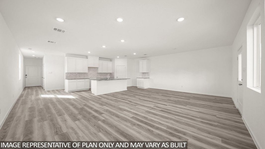 Open-concept living area featuring wood-finish flooring, recessed lighting, and white walls