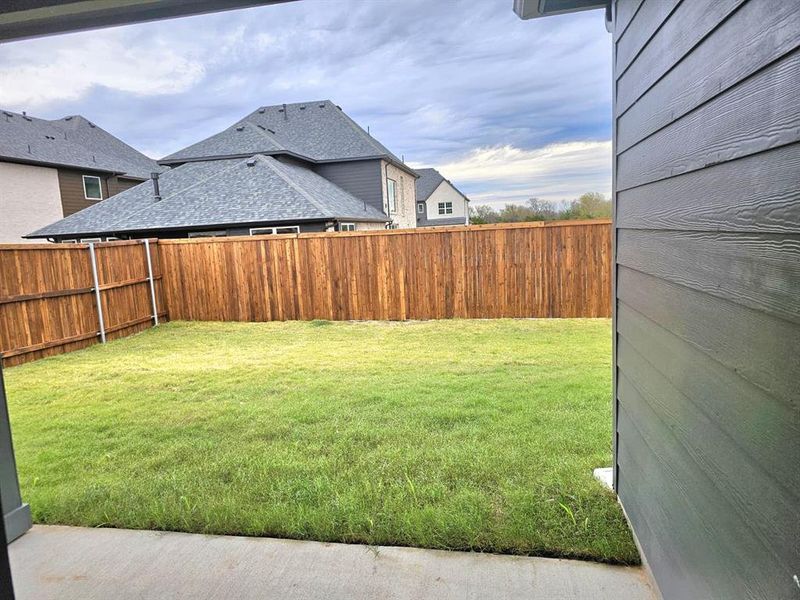 View of fenced backyard