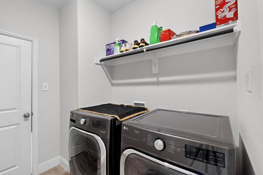Laundry room with baseboards and washing machine and clothes dryer Laundry room with baseboards and washing machine and clothes dryer