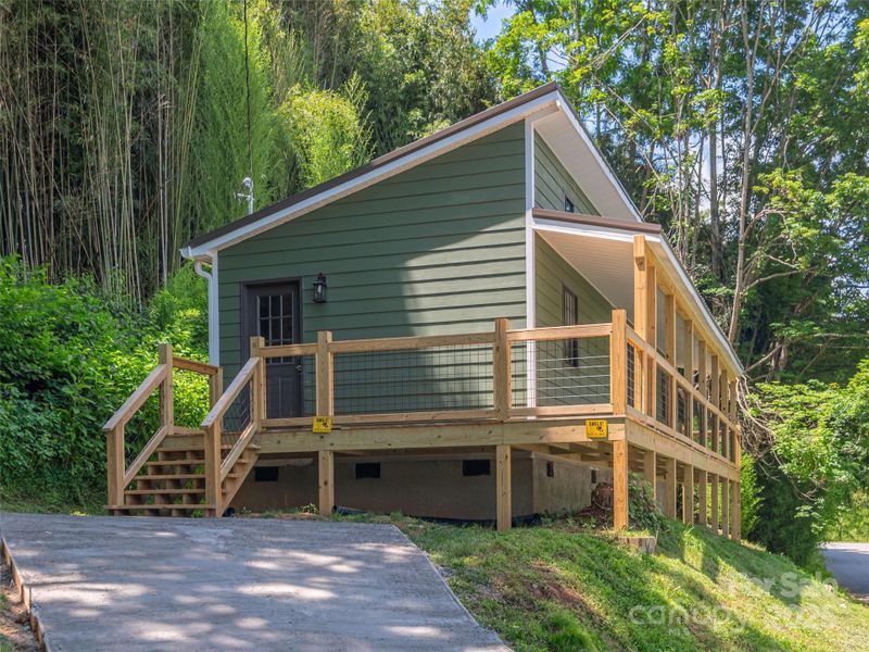 Front exterior of a new home in , Waynesville, NC, highlighting curb appeal (Image 19).