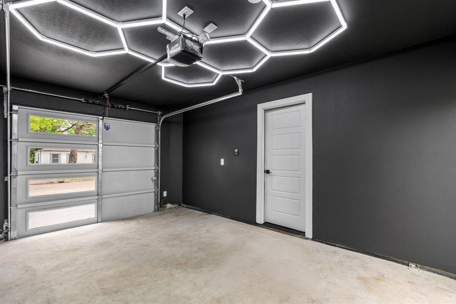 Garage featuring a garage door opener