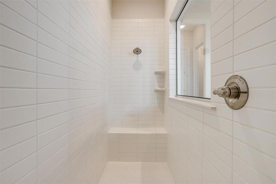 Bathroom featuring a tile shower