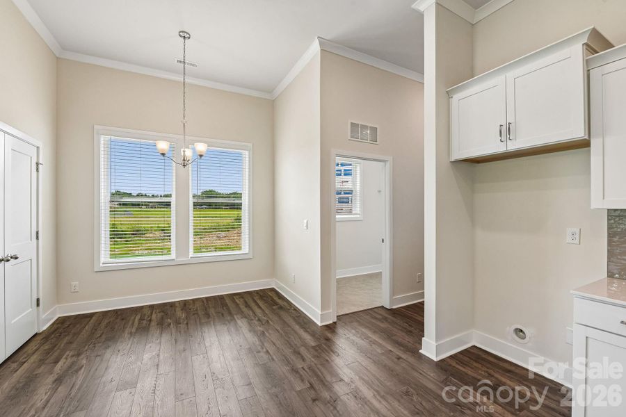 Spacious, unfurnished interior of a new home in Sanctuary at Southgate, Indian Trail (Image 11).