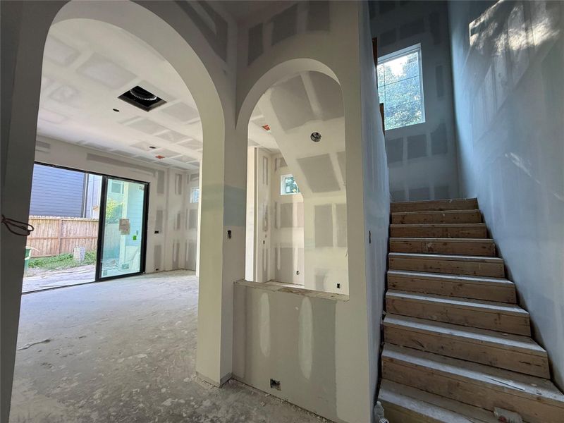 Bonus wet bar area under the staircase with wine fridge