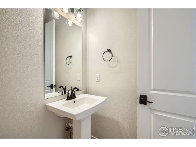 Furnished interior view inside a new home in RainDance National 60/70, Windsor (Image 11).