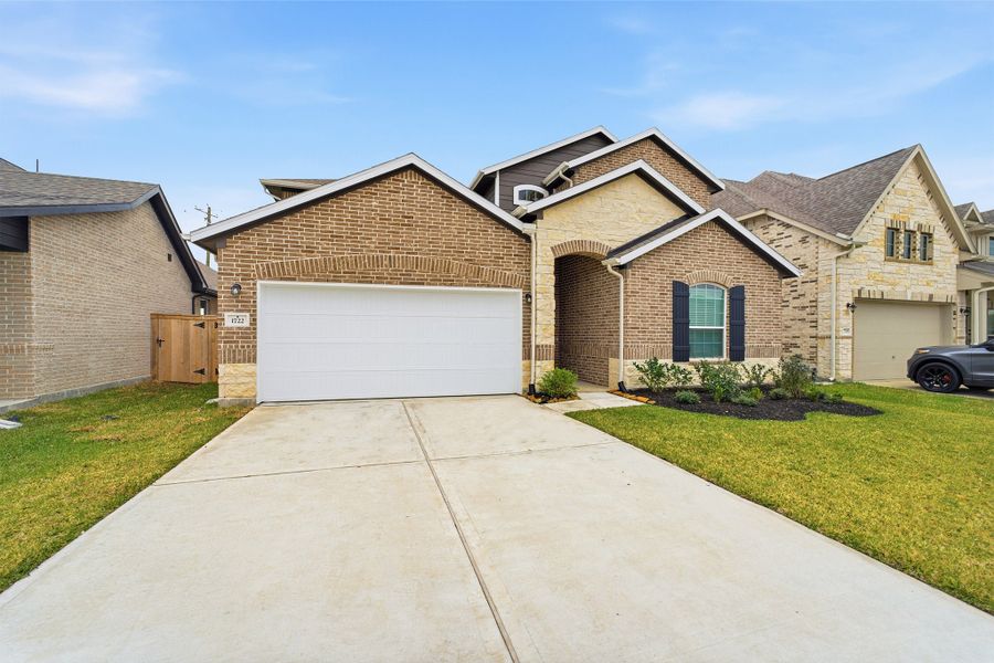 Front exterior of a new home in Windrose Green, Angleton, TX, highlighting curb appeal (Image 19). Front exterior of a new home in Windrose Green, Angleton, TX, highlighting curb appeal (Image 19).