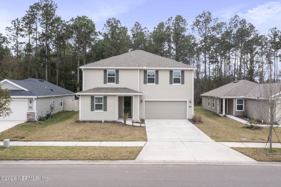 Front exterior of a new home in , Green Cove Springs, FL, highlighting curb appeal (Image 1). Front exterior of a new home in , Green Cove Springs, FL, highlighting curb appeal (Image 1).