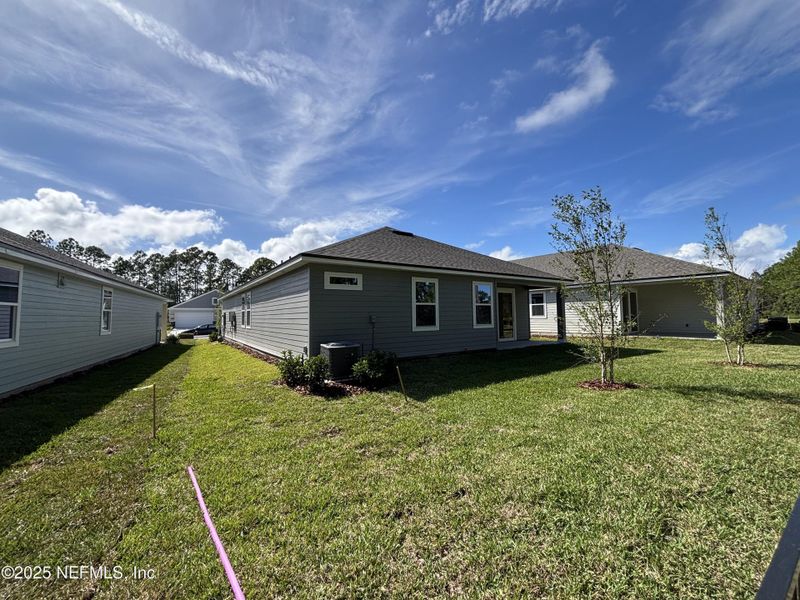 Exterior details and patio area of a home in The Magnolia Series at Reserve East, Flagler Beach (Image 21).