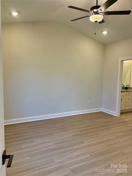 Photo Taken 11/29Large Primary With LVP Flooring and 11' Vaulted Ceiling!