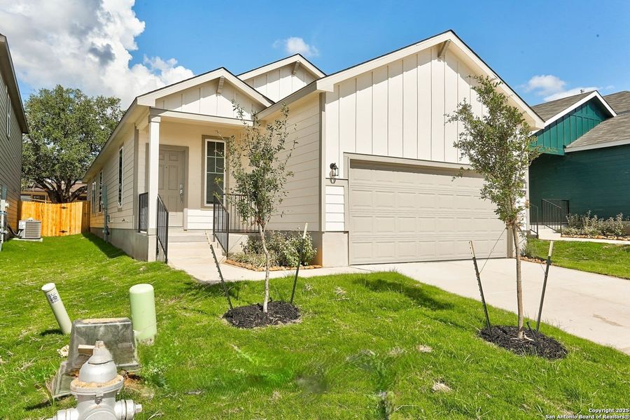 Front exterior of a new home in Fairway Crossing 40s, San Antonio, TX, highlighting curb appeal (Image 2). Front exterior of a new home in Fairway Crossing 40s, San Antonio, TX, highlighting curb appeal (Image 2).