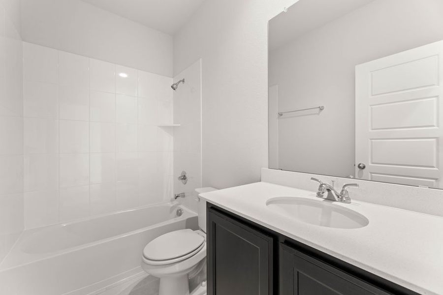 Representative exterior photo of a completed home built from the Winchester by Impression Homes in Timberbrook, Justin, TX (Image 22).