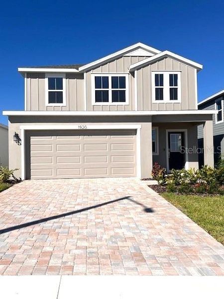 Front exterior of a new home in Hamilton Bluff, Haines City, FL, highlighting curb appeal (Image 1). Front exterior of a new home in Hamilton Bluff, Haines City, FL, highlighting curb appeal (Image 1).
