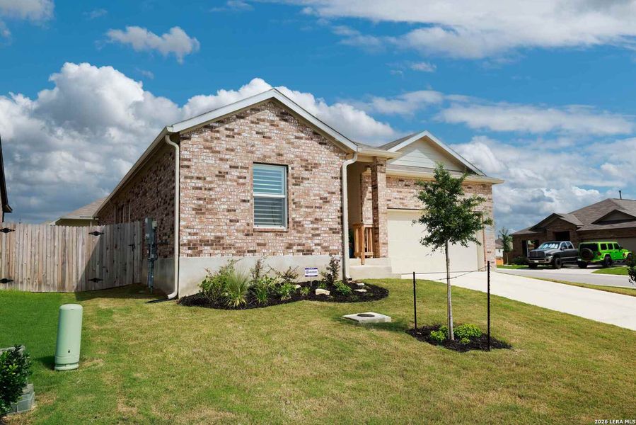 Front exterior of a new home in Hidden Trails, Bulverde, TX, highlighting curb appeal (Image 24).