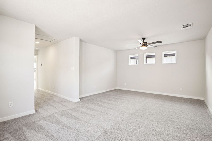 A room with a ceiling fan and a ceiling fan.