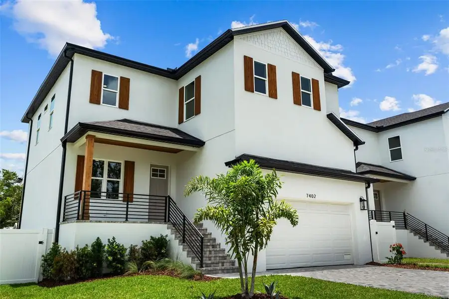 Front exterior of a new home in , Tampa, FL, highlighting curb appeal (Image 1). Front exterior of a new home in , Tampa, FL, highlighting curb appeal (Image 1).