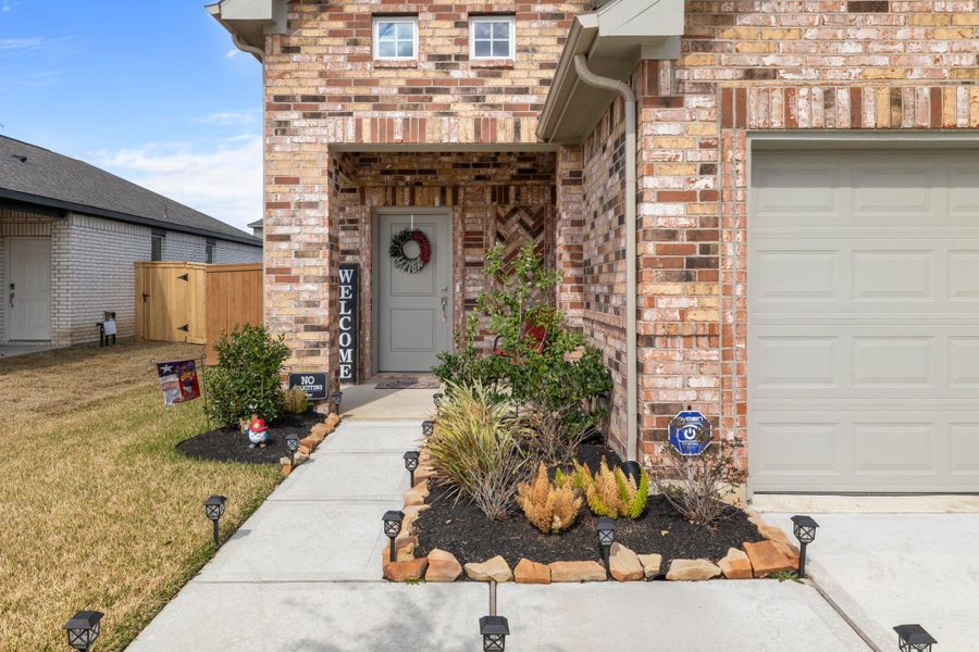Exterior details and patio area of a home in , Iowa Colony (Image 24).