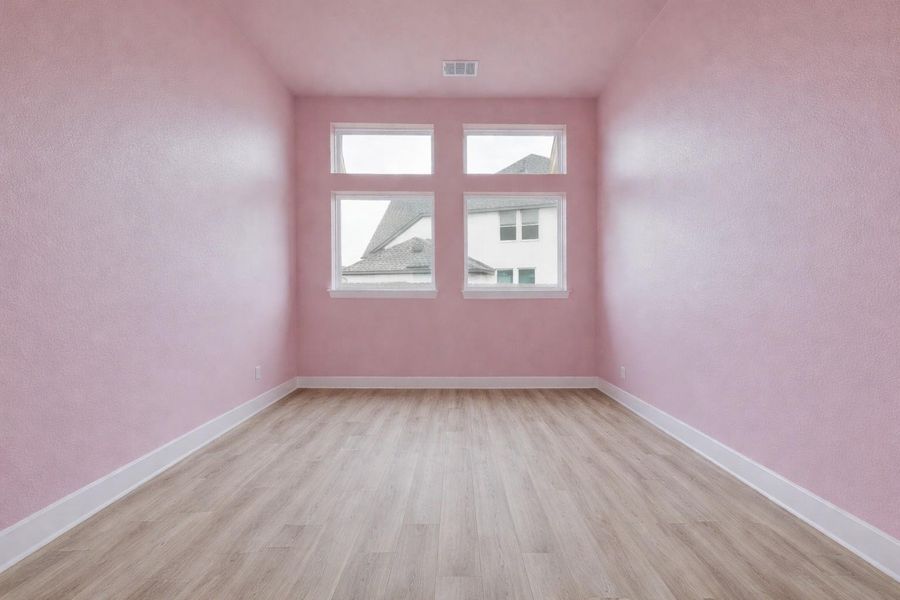 This room features smooth, light-colored flooring and pink walls with white trim
