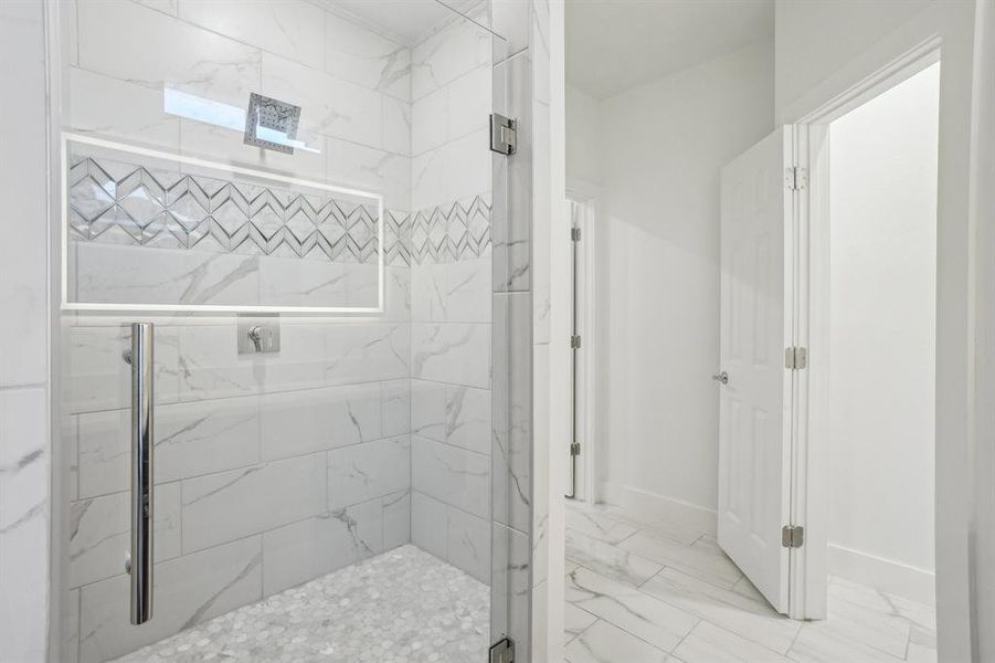 Primary Bathroom with a shower with door