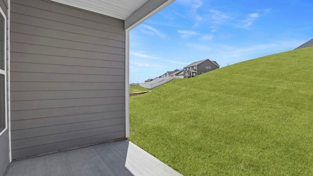 Exterior details and patio area of a home in Whitehawk Meadows, Travelers Rest (Image 15).