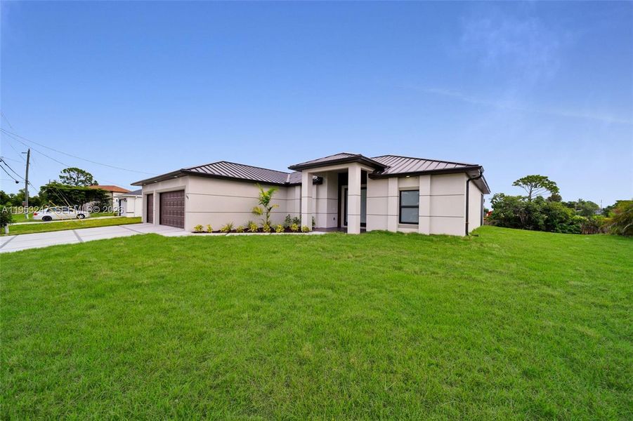 Front exterior of a new home in , Cape Coral, FL, highlighting curb appeal (Image 27).