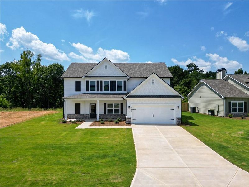 Front exterior of a new home in Harmony Farms, Eatonton, GA, highlighting curb appeal (Image 26).