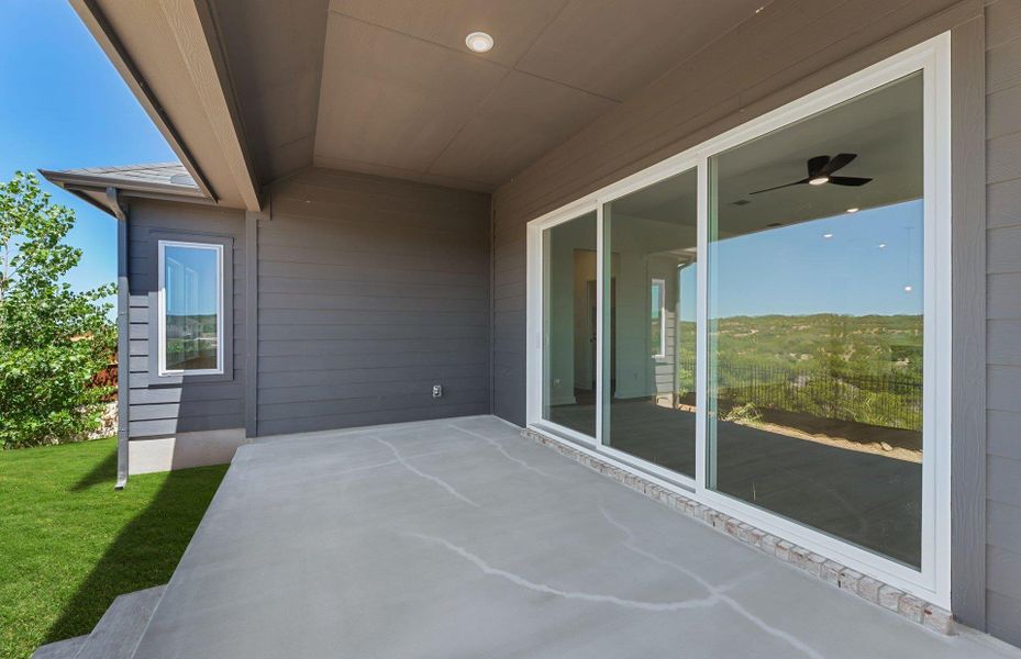 Exterior details and patio area of a home in West Cypress Hills, Spicewood (Image 3).