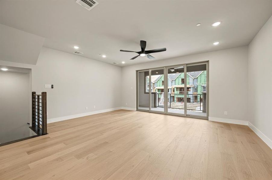 This spacious, light filled family rooms is adjacent to the kitchen and dining areas and perfectly designed for entertaining!