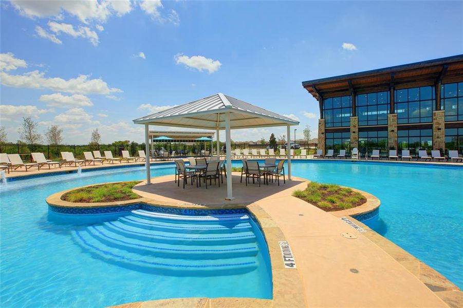 View of swimming pool with a patio area, pool water feature, and a gazebo