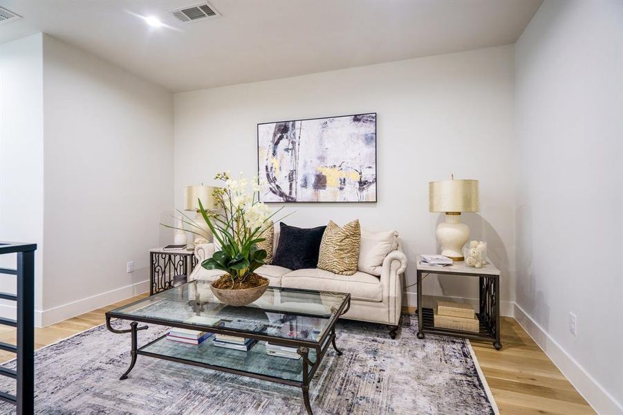 Living room with hardwood / wood-style floors