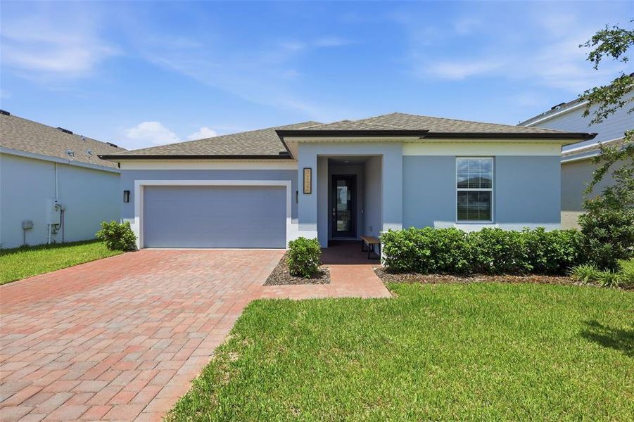 Front exterior of a new home in , Groveland, FL, highlighting curb appeal (Image 25).