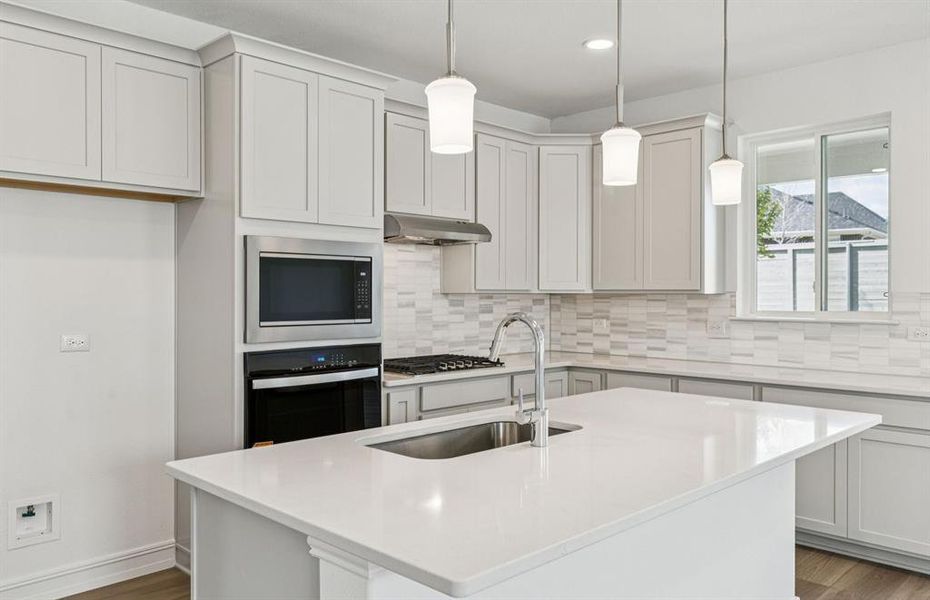 Spacious eat-in kitchen designed with a nice island for dining Spacious eat-in kitchen designed with a nice island for dining